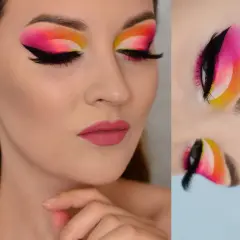Oczy z wyrazistym makijażem typu cut crease w odcieniach różu, pomarańczy i żółci. Czarne kreski i długie rzęsy podkreślają spojrzenie.