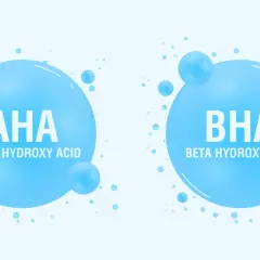 Dwa bąbelki z napisem AHA (Alpha Hydroxy Acid) i BHA (Beta Hydroxy Acid). Kwasy AHA jakie to? To składniki kosmetyków.