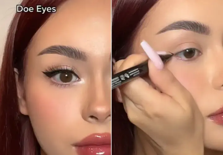 Kobieta z brązowymi oczami i błyszczącymi ustami tworzy makijaż typu "doe eyes", podkreślając spojrzenie eyelinerem.